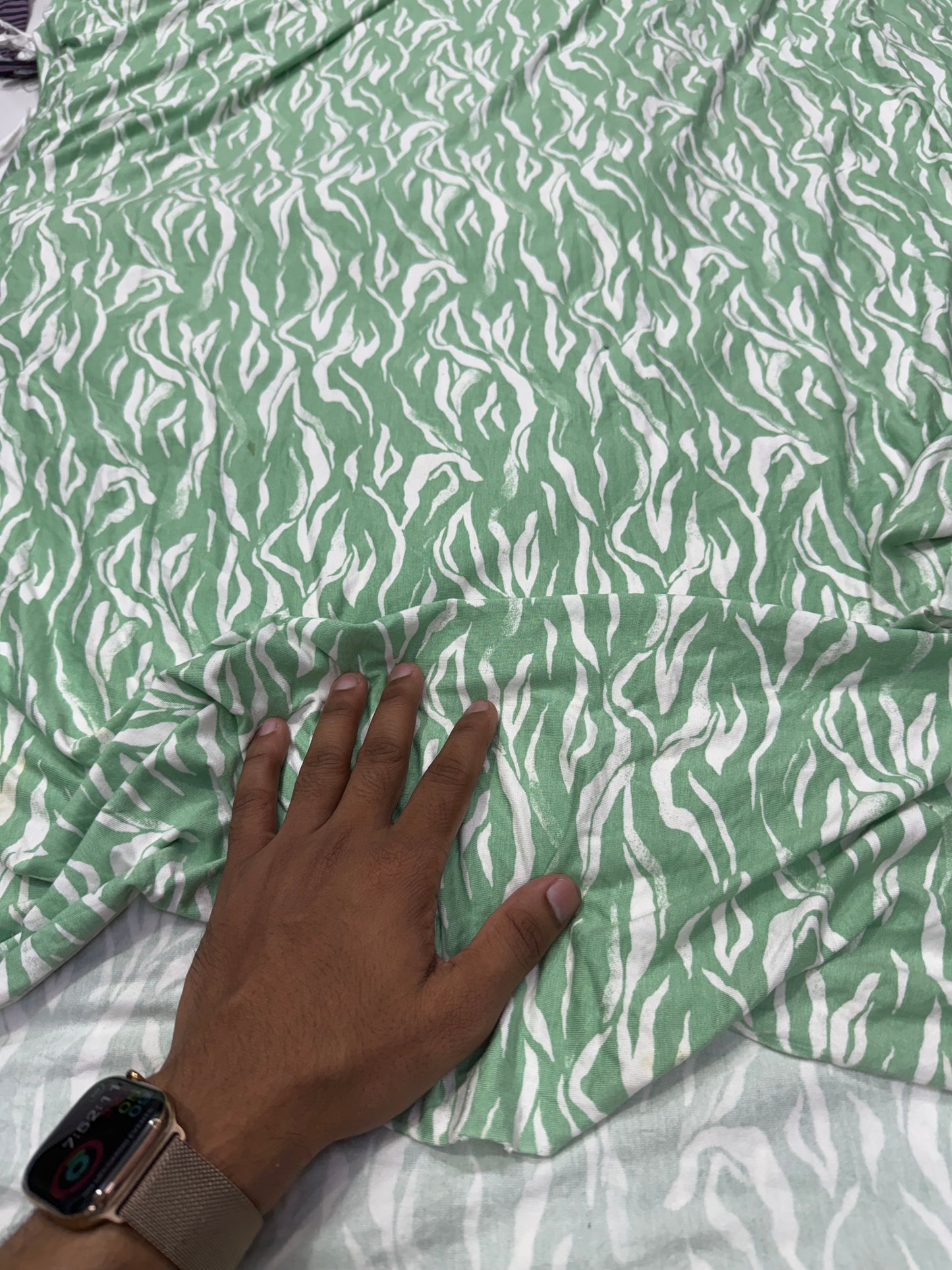 Buy Knitted Stretchable Green Base White Leafy Printed Fabric