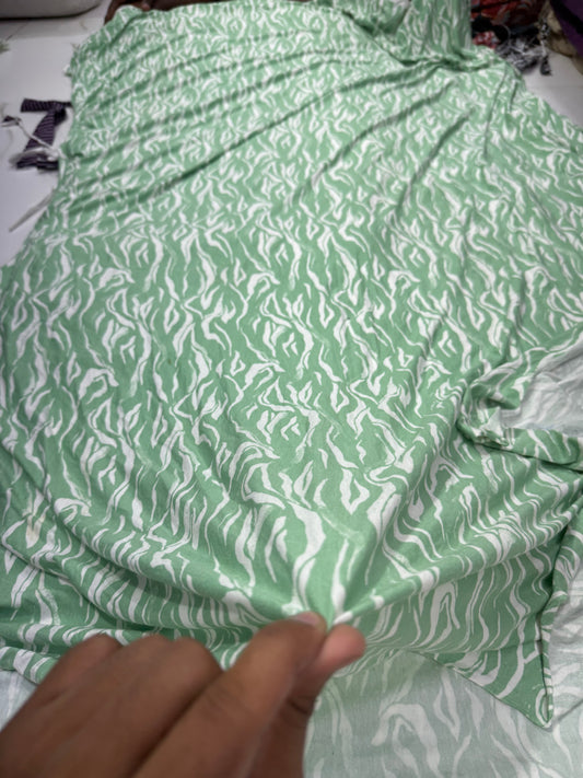 Buy Knitted Stretchable Green Base White Leafy Printed Fabric