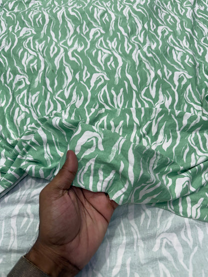 Buy Knitted Stretchable Green Base White Leafy Printed Fabric